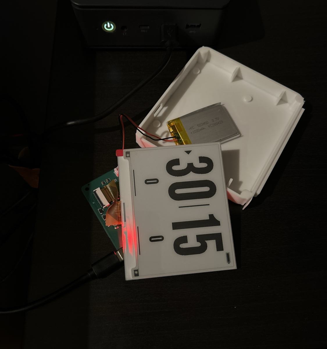 Prototype showing 30–15 on its e-ink screen